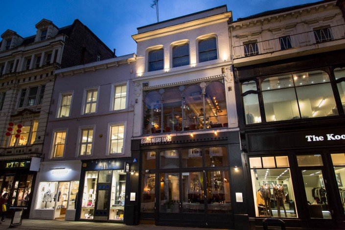 Dusk street view of El Gato Negro on King Street